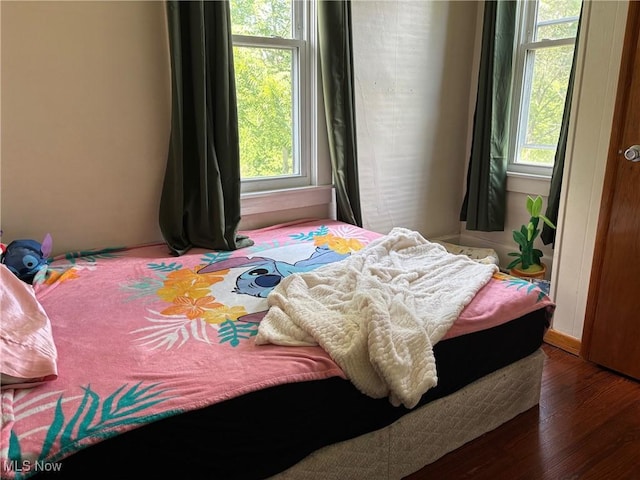 748 Belleview Rd, Cambridge, OH 43725 - bedroom with multiple windows and wood finished floors