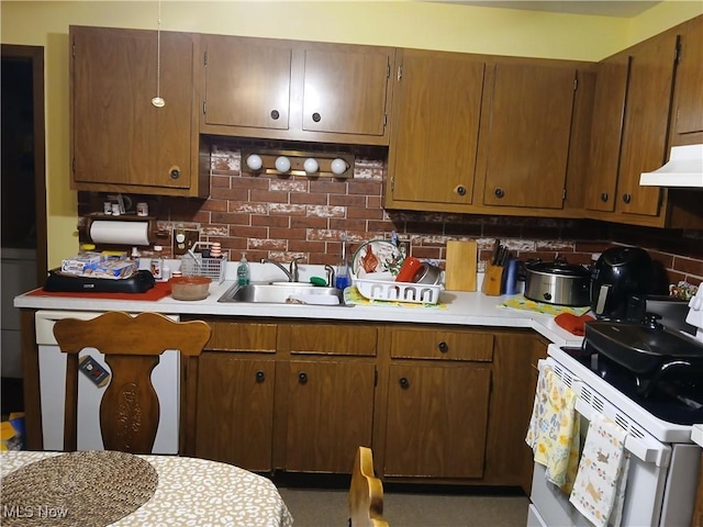 1403 Dorchester Dr, Madison, OH 44057 - kitchen with white electric range, light countertops, decorative backsplash, and under cabinet range hood