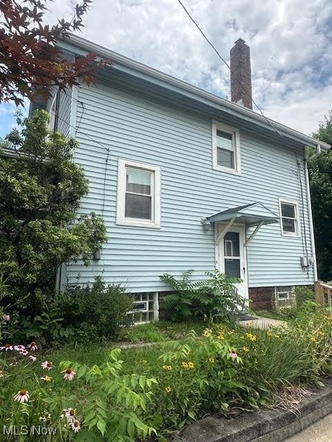 195 Water St, Wadsworth, OH 44281 - back of property featuring a chimney