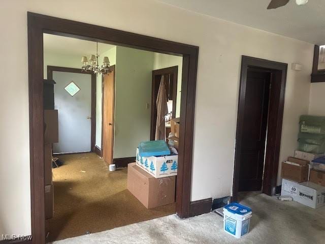 195 Water St, Wadsworth, OH 44281 - corridor featuring carpet flooring and a chandelier
