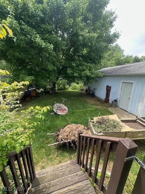 195 Water St, Wadsworth, OH 44281 - view of green lawn featuring a deck