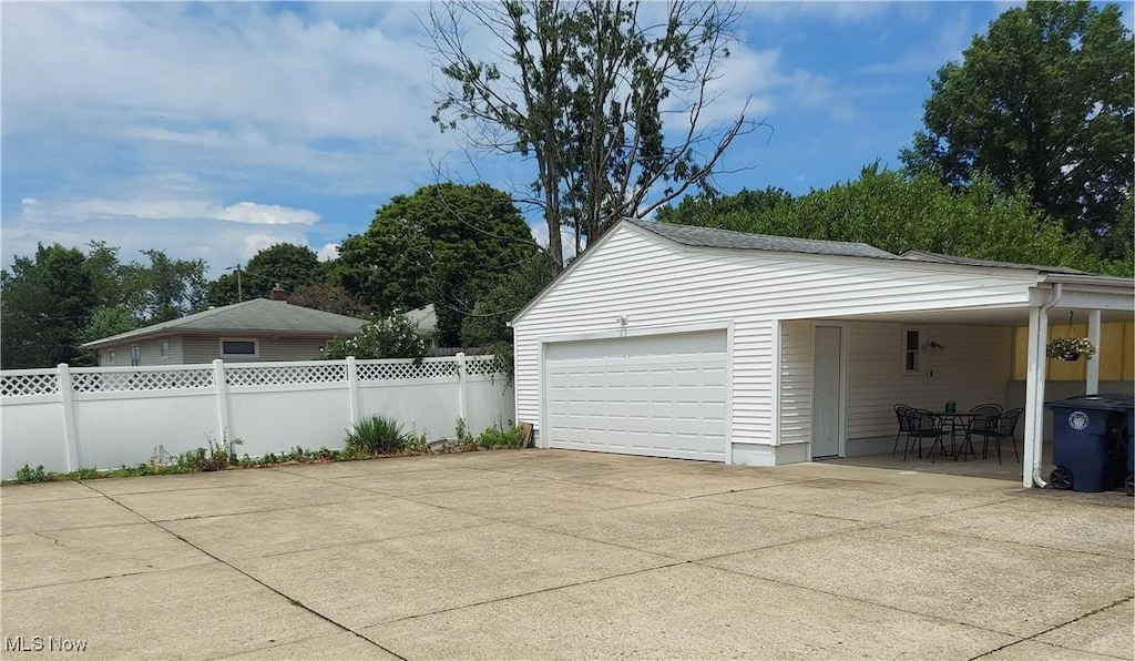 594-596 Hillman Rd, Akron, OH 44312 - garage with driveway and a carport
