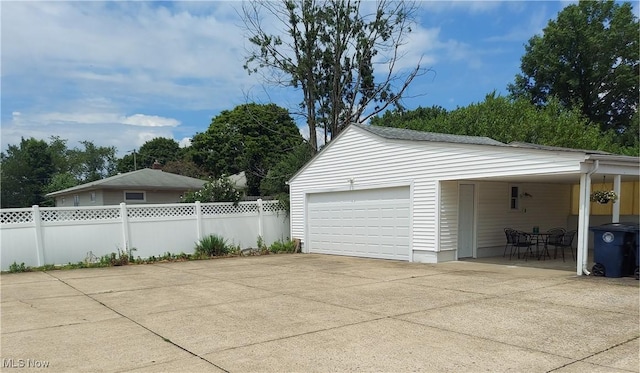 594-596 Hillman Rd, Akron, OH 44312 - garage with driveway and a carport