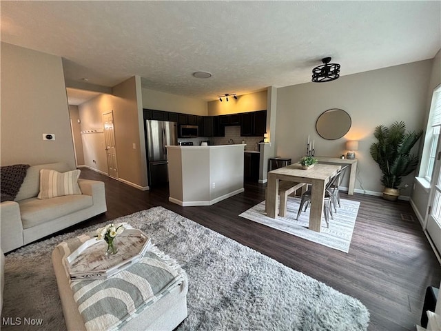 1314 Wellingshire Cir, Cuyahoga Falls, OH 44221 - living area featuring dark wood-type flooring and a textured ceiling