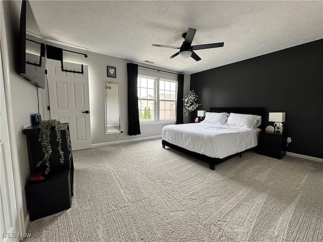 1314 Wellingshire Cir, Cuyahoga Falls, OH 44221 - bedroom featuring a textured ceiling, light carpet, and ceiling fan