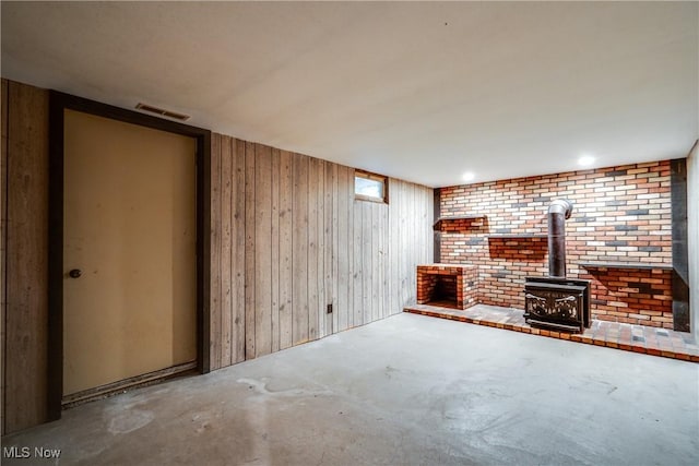 10154 Carlswood Ave NE, Hartville, OH 44632 - finished below grade area featuring a wood stove and wood walls