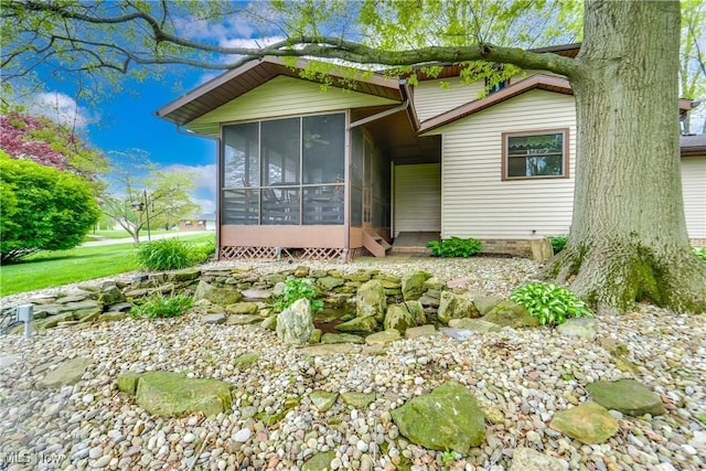10154 Carlswood Ave NE, Hartville, OH 44632 - view of front facade with a sunroom