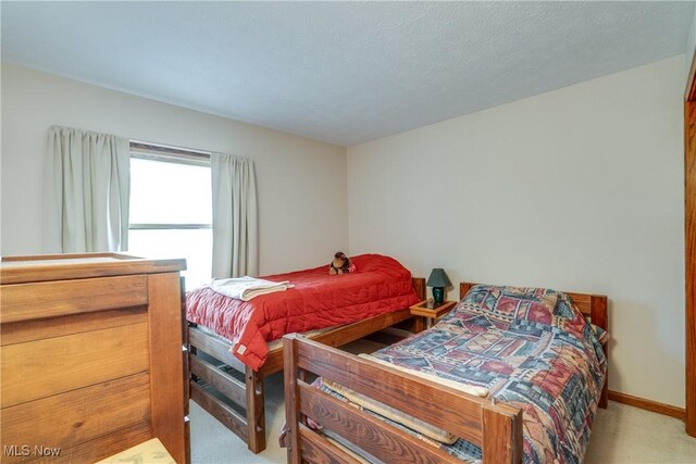 10154 Carlswood Ave NE, Hartville, OH 44632 - bedroom featuring carpet flooring and baseboards