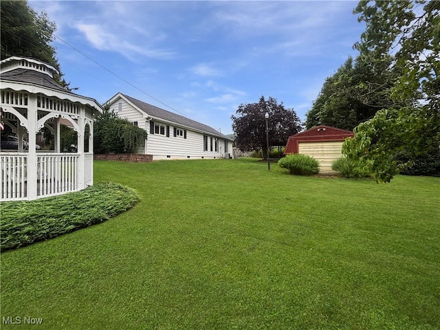 507 Harker Ave, Newell, WV 26050 - view of green lawn featuring a gazebo, a garage, and an outbuilding