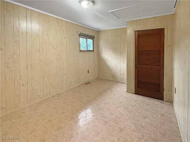 507 Harker Ave, Newell, WV 26050 - unfurnished room featuring wooden walls and brick patterned flooring