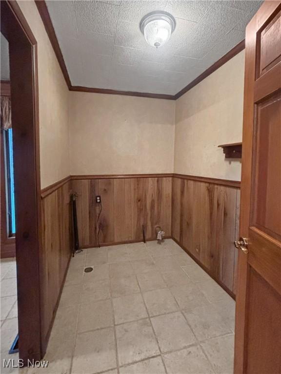 507 Harker Ave, Newell, WV 26050 - unfurnished room with crown molding and wainscoting