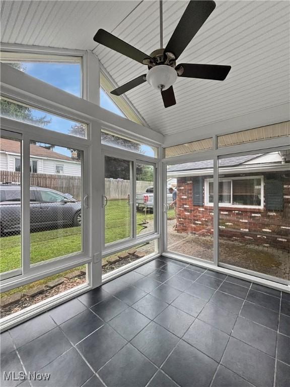 507 Harker Ave, Newell, WV 26050 - unfurnished sunroom with vaulted ceiling and a ceiling fan