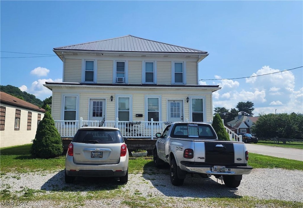 201 Ohio St, Brilliant, OH 43913 - view of front facade featuring a porch and a metal roof