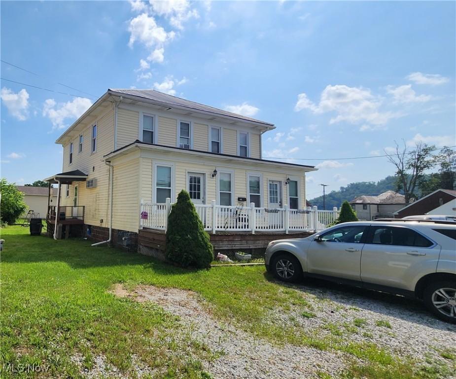 201 Ohio St, Brilliant, OH 43913 - view of front of property featuring a front lawn
