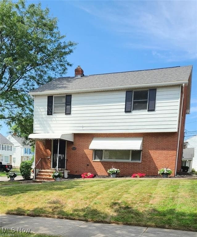 16805 Scottsdale Blvd, Shaker Heights, OH 44120 - view of front of property featuring brick siding and a front lawn