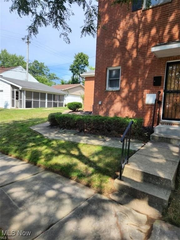 16805 Scottsdale Blvd, Shaker Heights, OH 44120 - view of green lawn featuring a sunroom