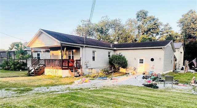 617 Valley St, Minerva, OH 44657 - rear view of property featuring stairway, a yard, and covered porch