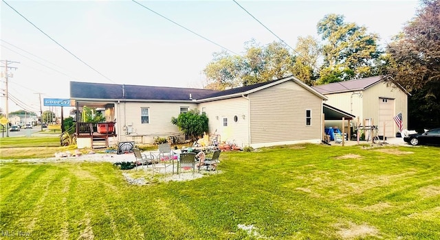 617 Valley St, Minerva, OH 44657 - back of house featuring a lawn