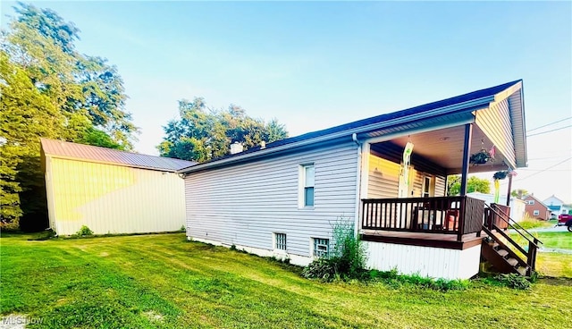 617 Valley St, Minerva, OH 44657 - view of property exterior featuring a lawn and covered porch