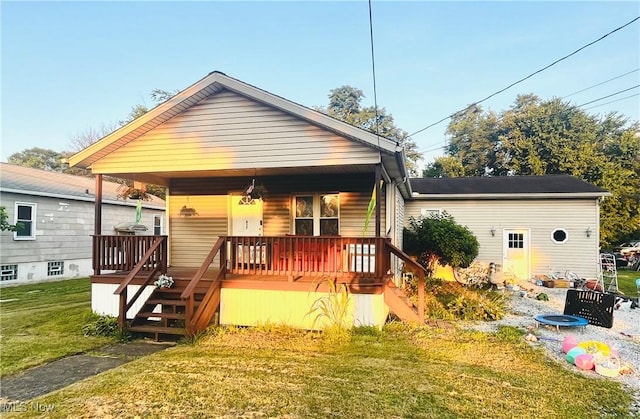 617 Valley St, Minerva, OH 44657 - bungalow-style home featuring a porch, a front yard, and stairway