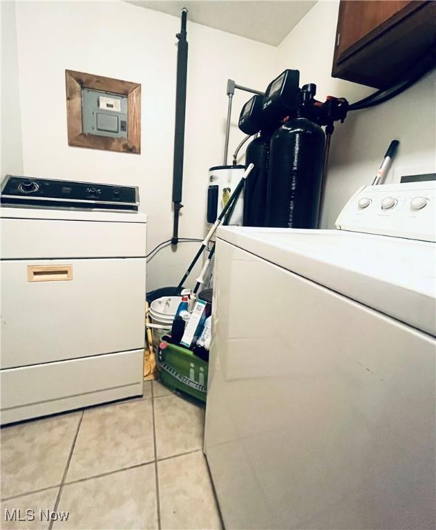 617 Valley St, Minerva, OH 44657 - laundry room featuring cabinet space, light tile patterned floors, washer and dryer, and electric panel