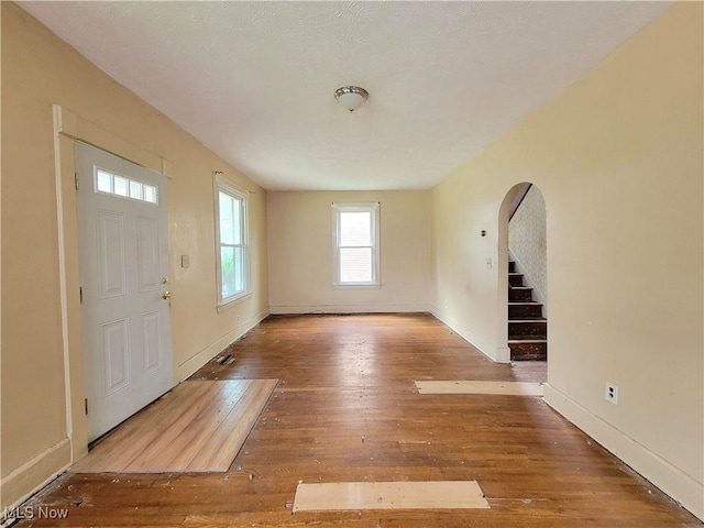 1707 23rd St, Parkersburg, WV 26101 - entrance foyer featuring arched walkways, hardwood / wood-style flooring, and stairway