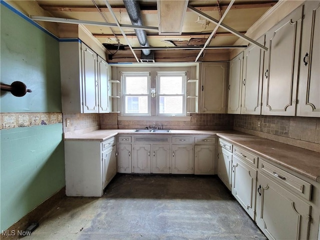 1707 23rd St, Parkersburg, WV 26101 - kitchen with open shelves, unfinished concrete floors, and tasteful backsplash