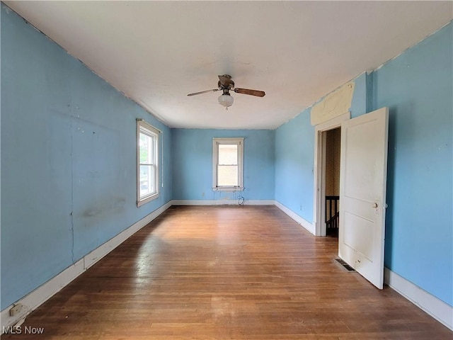 1707 23rd St, Parkersburg, WV 26101 - empty room with wood finished floors and a ceiling fan