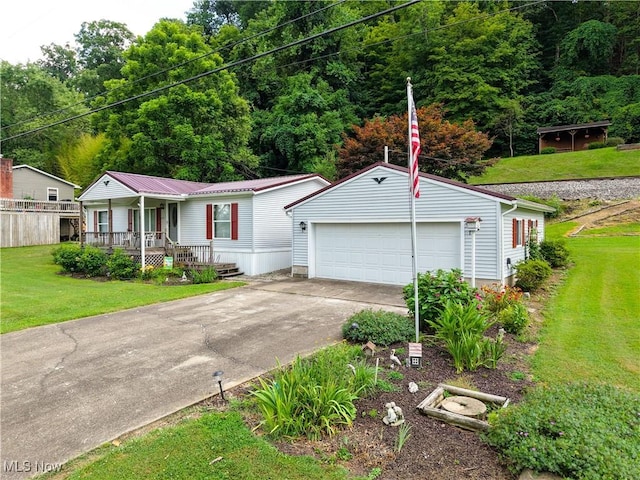 355 Muskingum River Rd, Marietta, OH 45750 - view of front of property with an outbuilding, a porch, a front lawn, a detached garage, and a metal roof