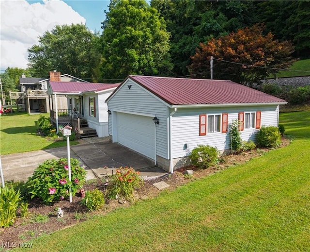 355 Muskingum River Rd, Marietta, OH 45750 - single story home with a front yard, a garage, a metal roof, a chimney, and covered porch