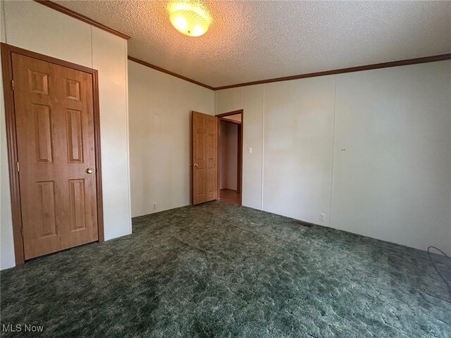 355 Muskingum River Rd, Marietta, OH 45750 - unfurnished bedroom featuring crown molding, carpet, and a textured ceiling