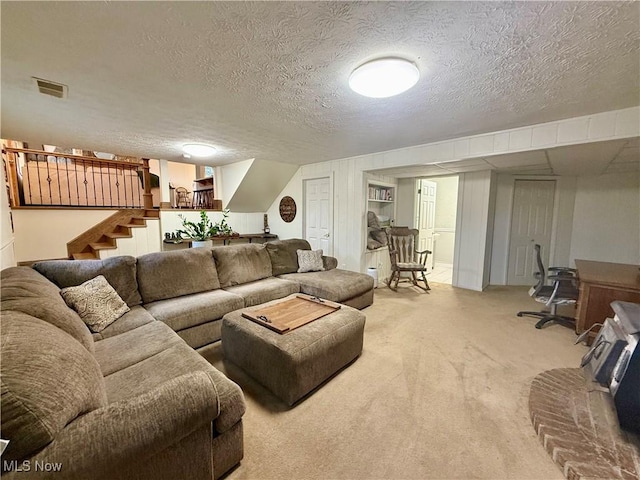 153 Lowes Dr, New Cumberland, WV 26047 - living room with carpet flooring, stairway, and a textured ceiling
