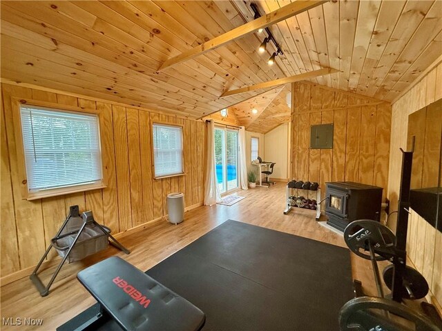153 Lowes Dr, New Cumberland, WV 26047 - workout room featuring wooden ceiling, wood finished floors, wood walls, lofted ceiling, and a wood stove