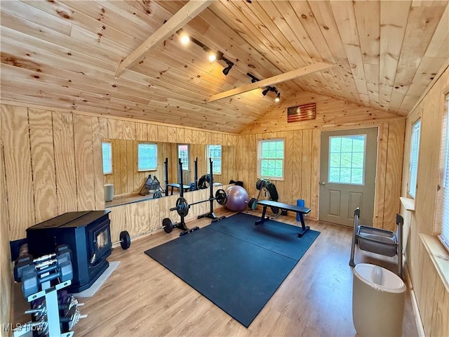 153 Lowes Dr, New Cumberland, WV 26047 - exercise area featuring wooden walls, wooden ceiling, vaulted ceiling, wood finished floors, and a wood stove