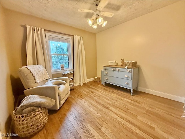 153 Lowes Dr, New Cumberland, WV 26047 - living area featuring ceiling fan, wood finished floors, and a textured ceiling