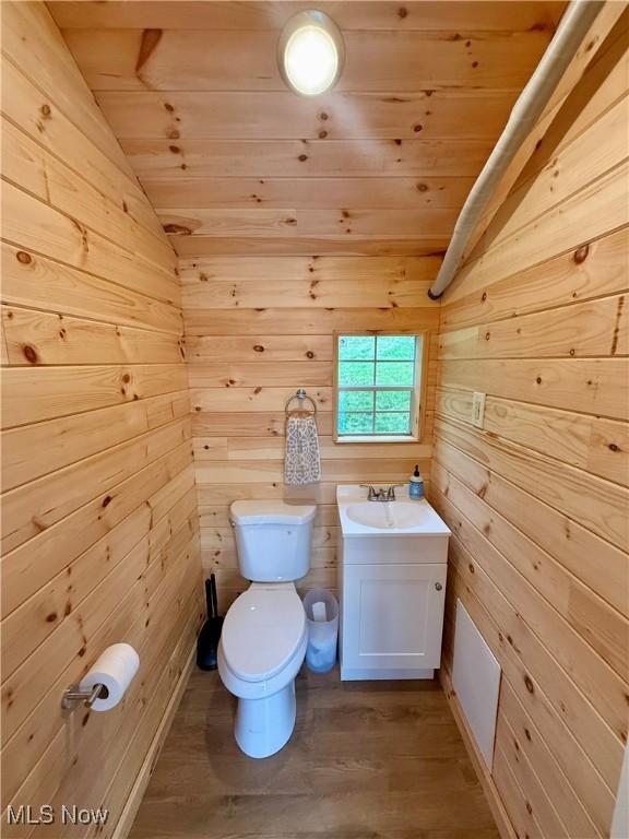 153 Lowes Dr, New Cumberland, WV 26047 - bathroom featuring wooden ceiling, lofted ceiling, wood walls, vanity, and wood finished floors