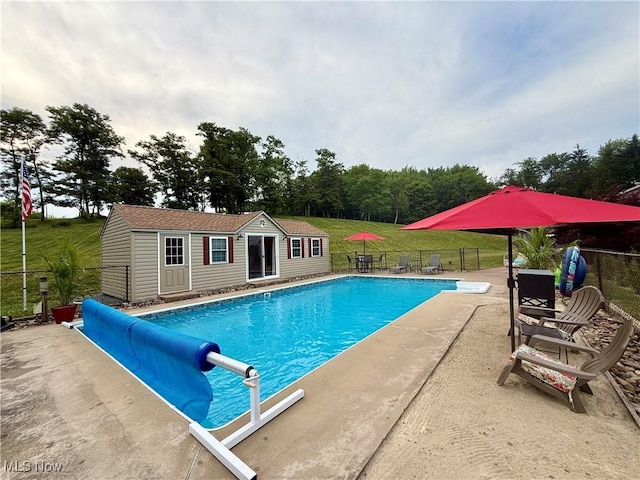 153 Lowes Dr, New Cumberland, WV 26047 - view of swimming pool featuring an outbuilding, a storage structure, and a patio