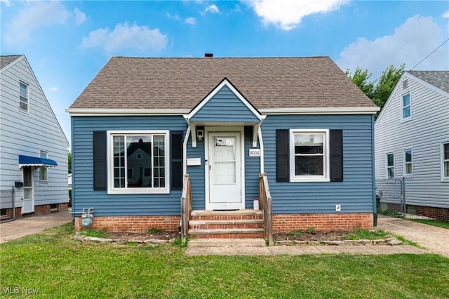 8006 Chesterfield Ave, Parma, OH 44129 - bungalow-style house with a front lawn and a shingled roof