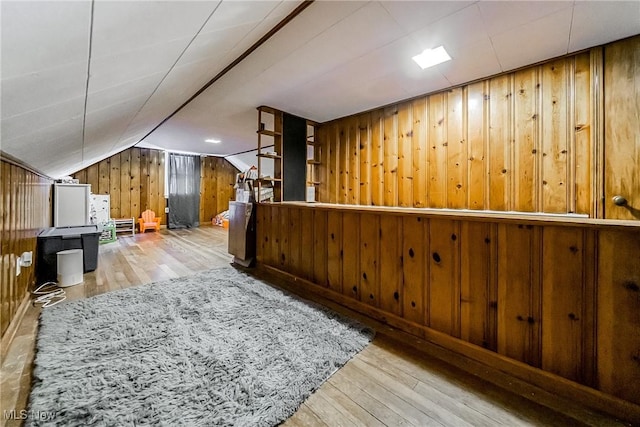 8006 Chesterfield Ave, Parma, OH 44129 - additional living space featuring wood walls, hardwood / wood-style flooring, and vaulted ceiling