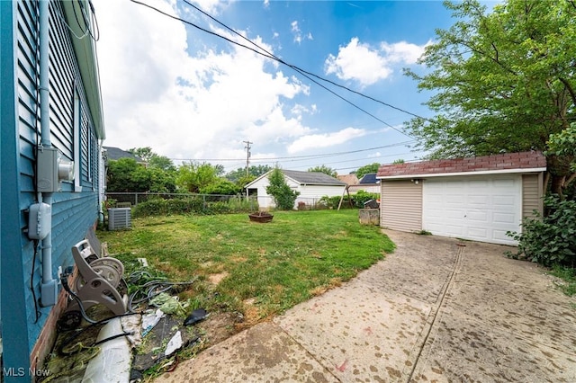 8006 Chesterfield Ave, Parma, OH 44129 - view of yard with concrete driveway, an outbuilding, and a garage