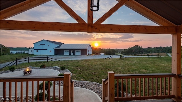 52110 Spencer Rd, Cumberland, OH 43732 - yard at dusk featuring an outdoor fire pit, a yard, and a patio