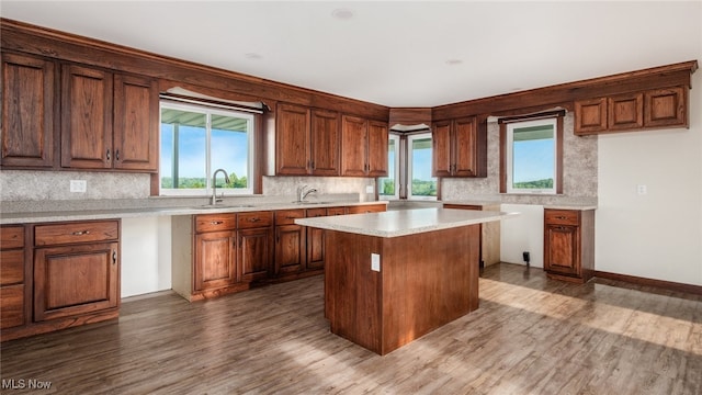 52110 Spencer Rd, Cumberland, OH 43732 - kitchen with tasteful backsplash, wood finished floors, light countertops, and healthy amount of natural light