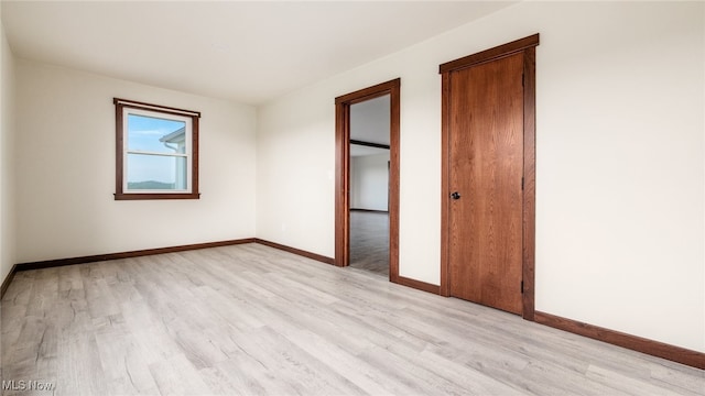 52110 Spencer Rd, Cumberland, OH 43732 - unfurnished bedroom featuring light wood finished floors and baseboards