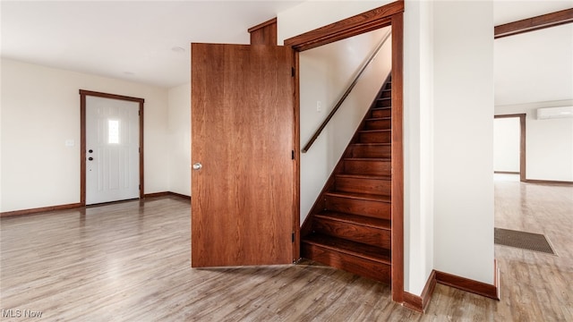 52110 Spencer Rd, Cumberland, OH 43732 - stairway with wood finished floors and a wall unit AC