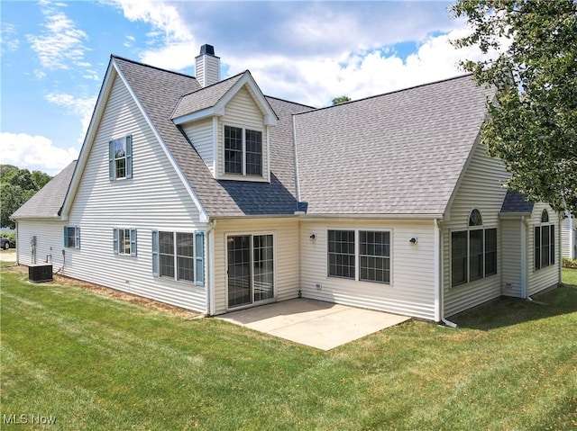 8531 Creekside Dr, Sagamore Hills, OH 44067 - rear view of house with a lawn, a patio, roof with shingles, and a chimney