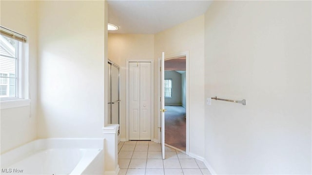 8531 Creekside Dr, Sagamore Hills, OH 44067 - full bath featuring healthy amount of natural light, a bath, and tile patterned flooring