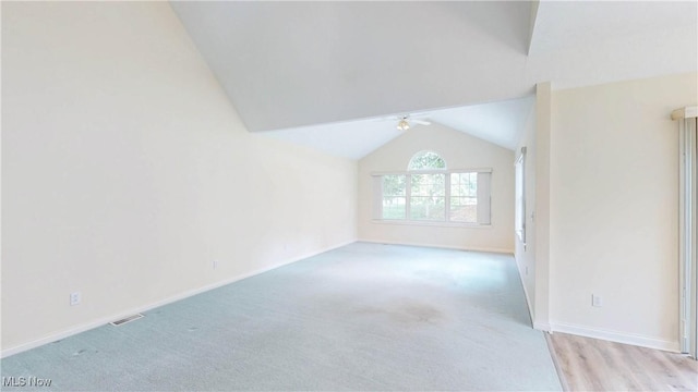 8531 Creekside Dr, Sagamore Hills, OH 44067 - unfurnished living room featuring lofted ceiling, ceiling fan, and light colored carpet