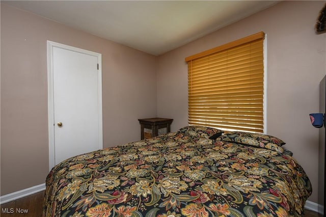1492 Ries St, Barberton, OH 44203 - bedroom with wood finished floors and baseboards