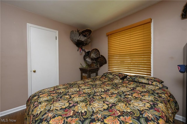 1492 Ries St, Barberton, OH 44203 - bedroom with wood finished floors and baseboards