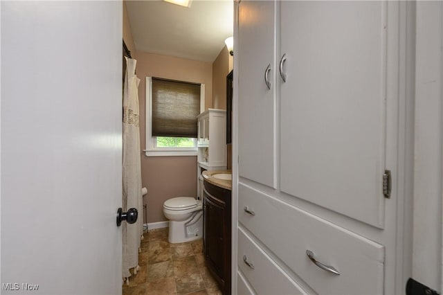 1492 Ries St, Barberton, OH 44203 - bathroom with stone finish flooring, vanity, and curtained shower